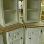 BU22 pair heart motif cupboards and open top cupboards